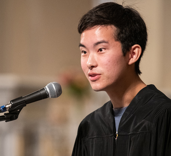A woman leans against a railing